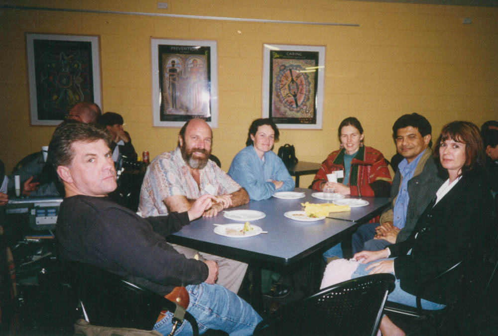A group of 6 people sitting around a table