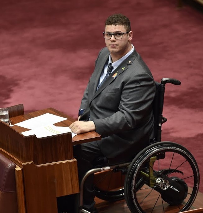 Jordan Steele-John sitting in his wheelchair in the Australian Senate chamber