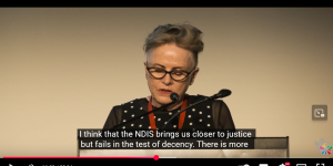 Lorna Hallahan speaking at a podium.