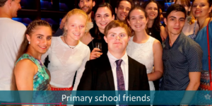 Young man with Down syndrome surrounded by friends